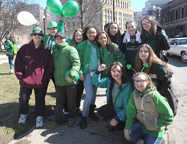 St. Mark School eight graders get pumped up as they prepare to march in the City of Buffalo Annual St. Patrick's Day Parade on Delaware Avenue. (Dan Cappellazzo/Staff Photographer)